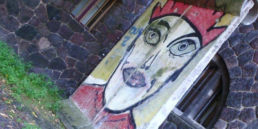 Photo of Berlin Wall piece with graffito by Kiddy Citny
