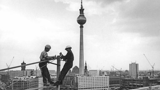 Construction workers atop the Haus der Statistik, 1969