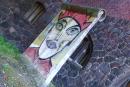 Photo of Berlin Wall piece with graffito by Kiddy Citny